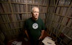 Mark Trehus, a record collector and owner of Treehouse records, was all smiles surrounded by a sea of only part of his record collection, Tuesday, Sep
