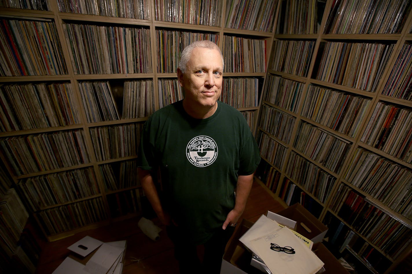 Mark Trehus, a record collector and owner of Treehouse records, was all smiles surrounded by a sea of only part of his record collection, Tuesday, September 23, 2014 in St. Paul, MN. ] (ELIZABETH FLORES/STAR TRIBUNE) ELIZABETH FLORES &#x2022; eflores@startribune.com