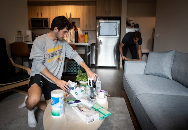 Josh Ichen and one of his roomates Nick Stan unpacked their stuff after having just moved into their apartment at the Identity Dinkytown building this