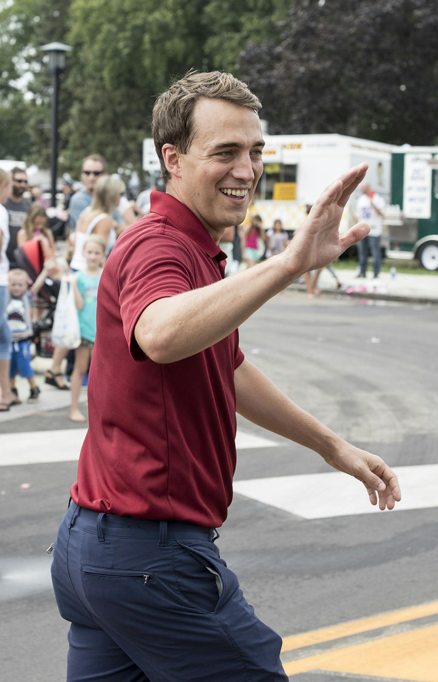 Joe Radinovich, Pete Stauber's Democratic challenger, at a parade in Chisago, Minn., Aug. 17, 2018. Progressives and environmentalists in the Twin Cities are at odds with farmers and miners, many of whom feel the Democratic Farmer Labor Party has left them behind. (Tim Gruber/The New York Times)