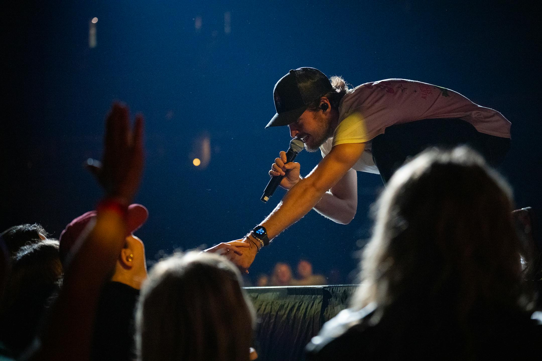Conner Smith performs as one of three opening acts for Luke Bryan at the Xcel Energy Center in St. Paul, Minn., on Saturday, Oct. 14, 2023.