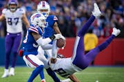 Minnesota Vikings wide receiver Justin Jefferson (18) caught a deep pass in the fourth quarter against Buffalo Bills cornerback Cam Lewis (39).