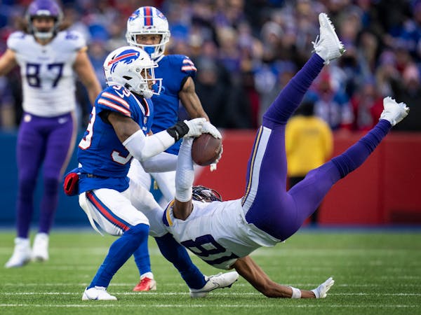 Minnesota Vikings wide receiver Justin Jefferson (18) caught a deep pass in the fourth quarter against Buffalo Bills cornerback Cam Lewis (39).