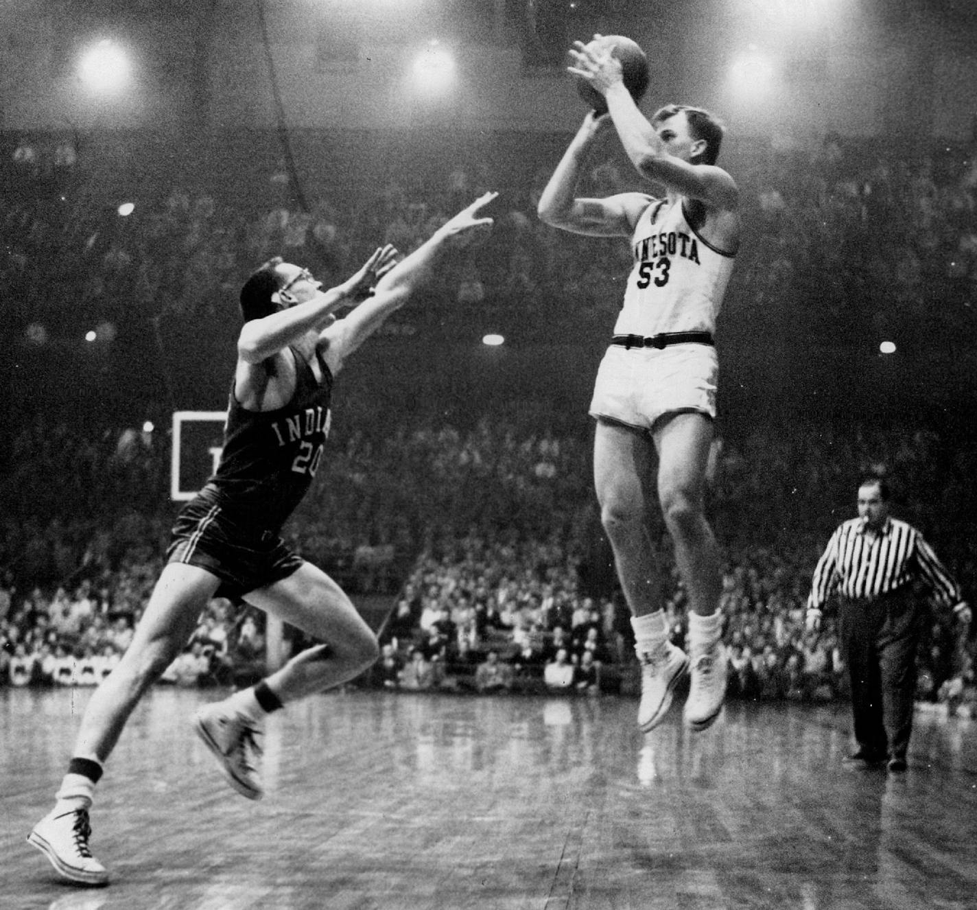 January 11, 1955 Deadeye Dick Garmaker of Minnesota is shown drawing a bead on the basket Monday night during the game with Indiana. Garmaker made this shot for two points and totaled 30 points during the evening. Jim Barley is making the futile effort to block the shot. The Gophers won 88-74 and now have a 2-1 record in Big Ten competition Bill Seaman, Minneapolis Star Tribune ORG XMIT: MIN2016030118201767