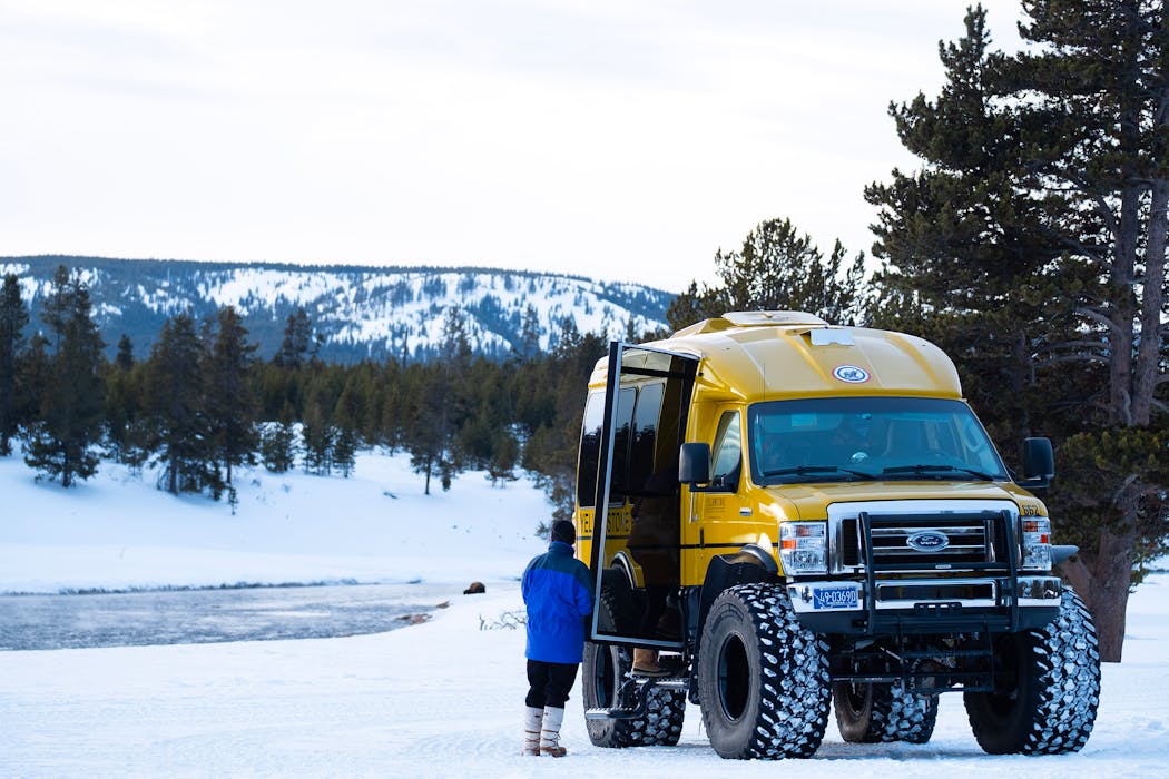 Preparing for a wilderness tour via snowcoach in Yellowstone National Park.