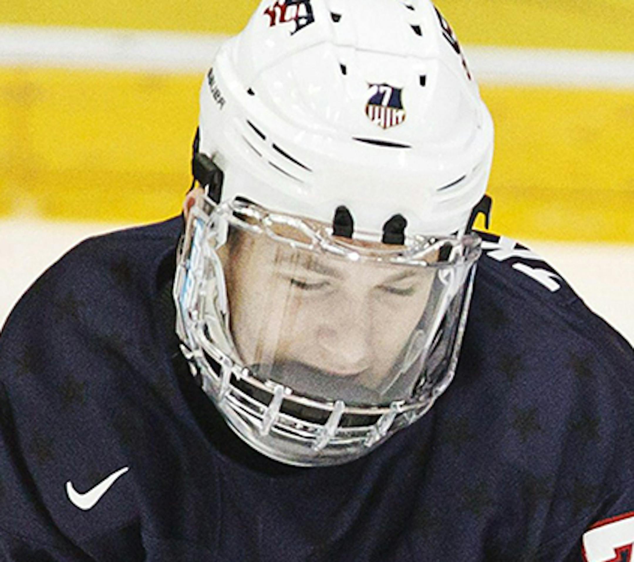 Matthew Tkachuk of the U.S, left, escapes from Denmark's Nikolaj Krag during the 2016 IIHF World Junior U20 Ice Hockey Championships tournament match between Denmark and USA in Helsinki, Finland, Thursday, Dec. 31, 2015. (Roni Rekomaa/Lehtikuva via AP) FINLAND OUT ORG XMIT: LON807