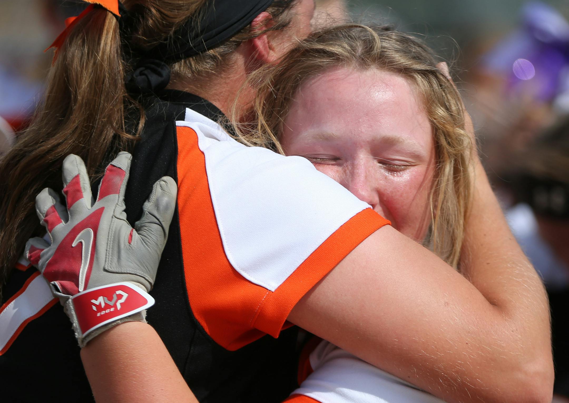 Farmington infielder Olivia Hazelbaker celebrated with Emma Frost after their victory. ] MARK VANCLEAVE &#xef; mark.vancleave@startribune.com * The Farmington Tigers defeated the Anoka Tornadoes 1-0 with a home run in the tenth inning, winning the Class 4A state championship on Friday, July 9, 2017 in North Mankato.