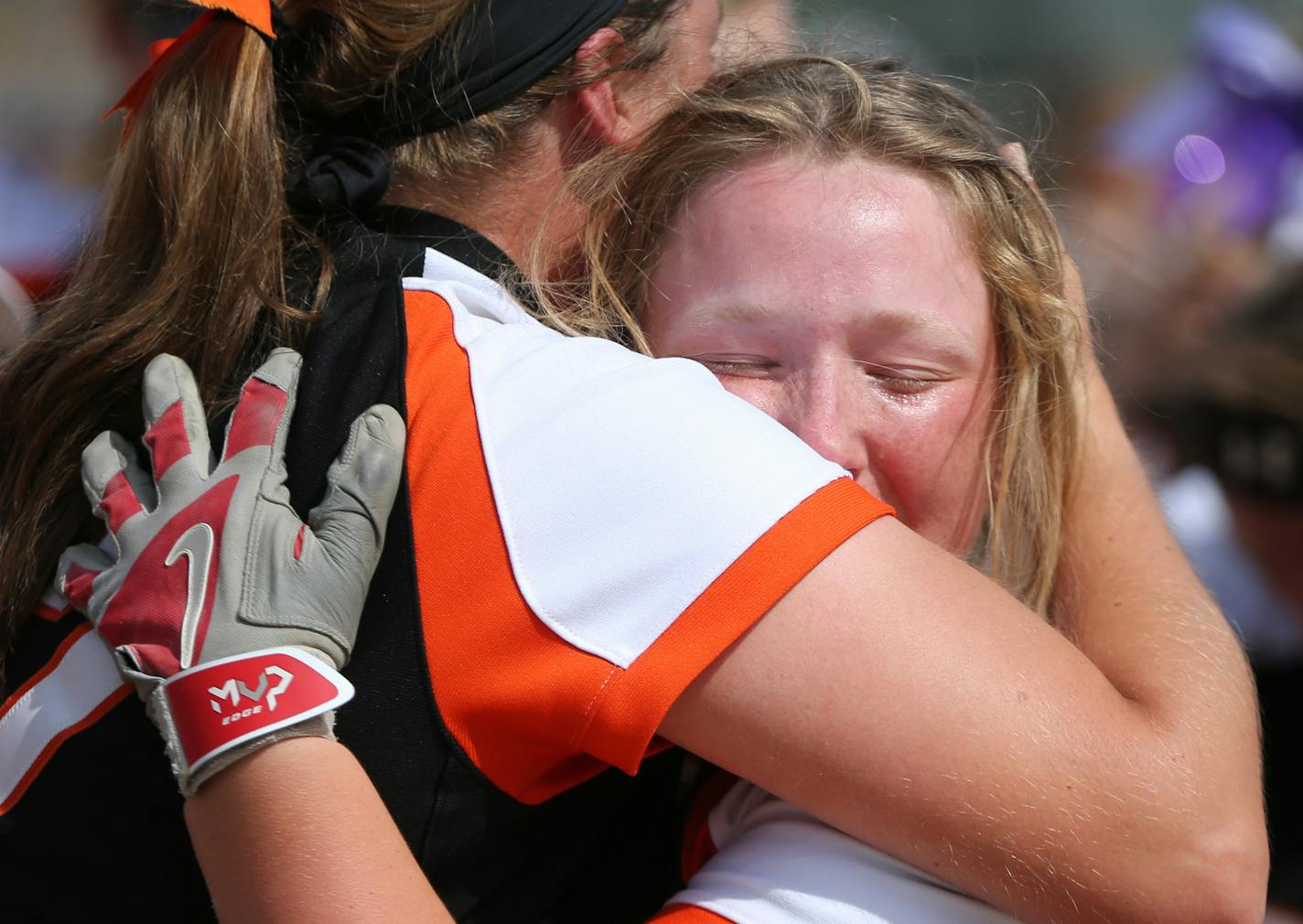 Farmington infielder Olivia Hazelbaker celebrated with Emma Frost after their victory. ] MARK VANCLEAVE &#xef; mark.vancleave@startribune.com * The Farmington Tigers defeated the Anoka Tornadoes 1-0 with a home run in the tenth inning, winning the Class 4A state championship on Friday, July 9, 2017 in North Mankato.