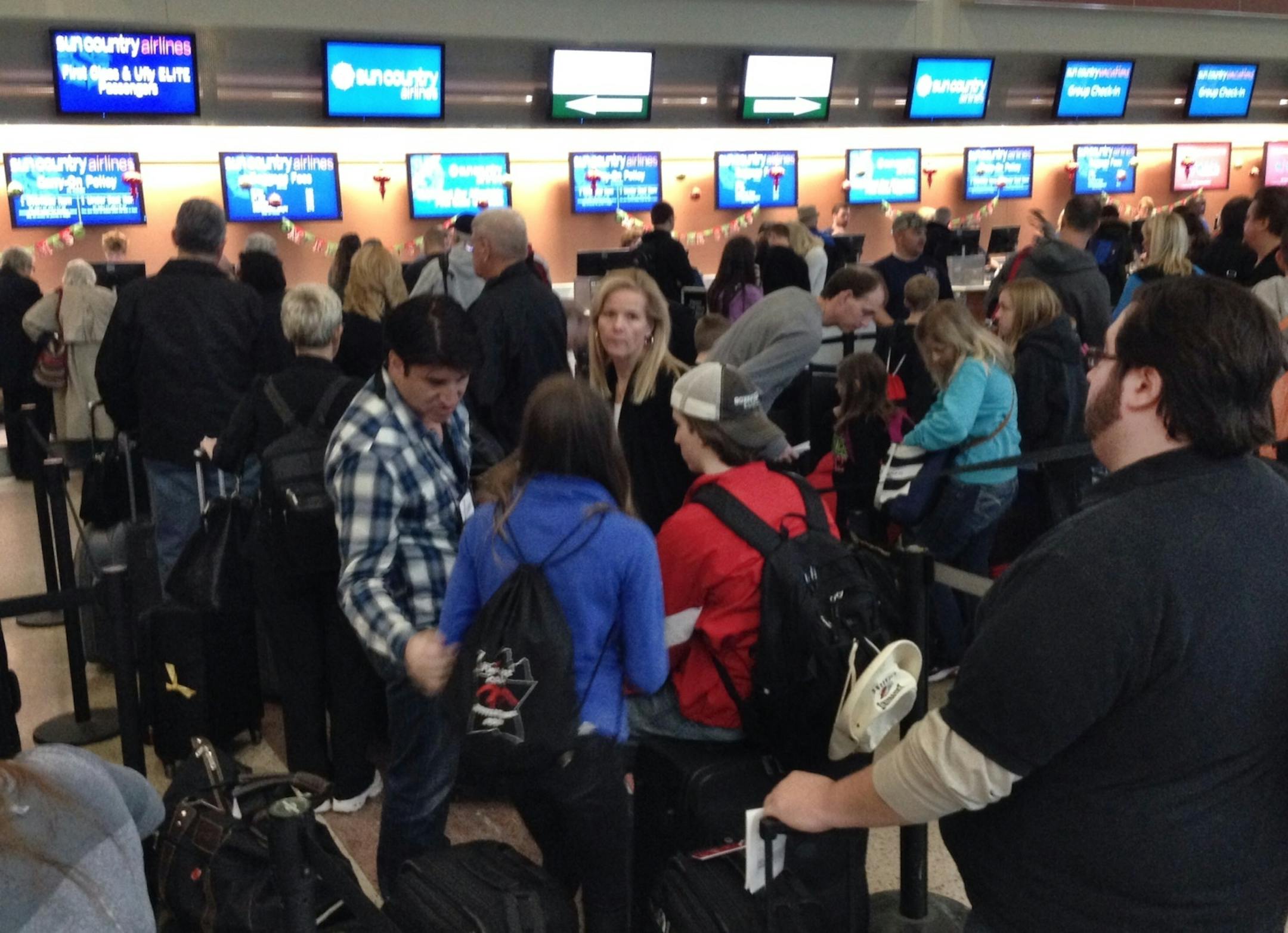 Travelers waited to check for Sun Country flights Friday at Terminal 2 at the Minneapolis St. Paul-International Airport. The terminal was closed for about two hours because of a suspicious package.