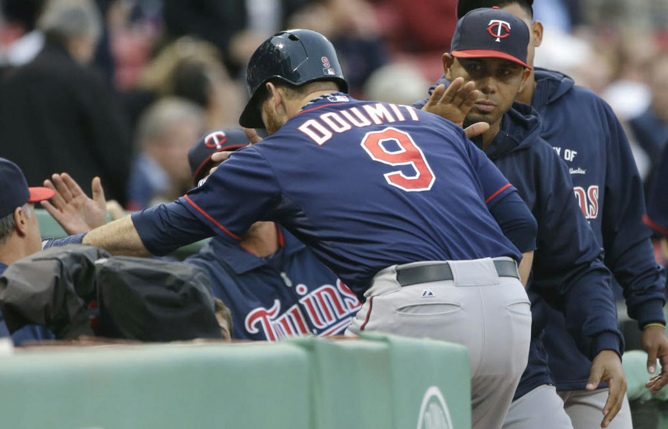 Designated hitter Ryan Doumit was welcomed back into the dugout after his two-run homer against the Red Sox during the Twins' four-run first inning. The Twins added seven more runs in the second.