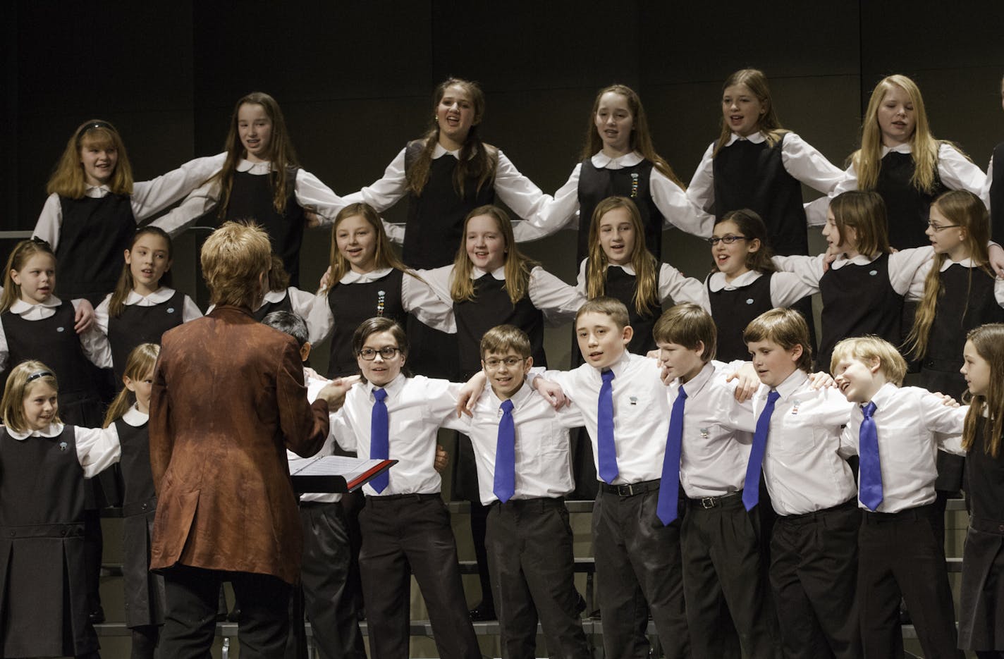 Photo by Mark Riddle Angelica Cantanti Youth Choir Director Ann Schrooten conducting the Cantabile Choir.