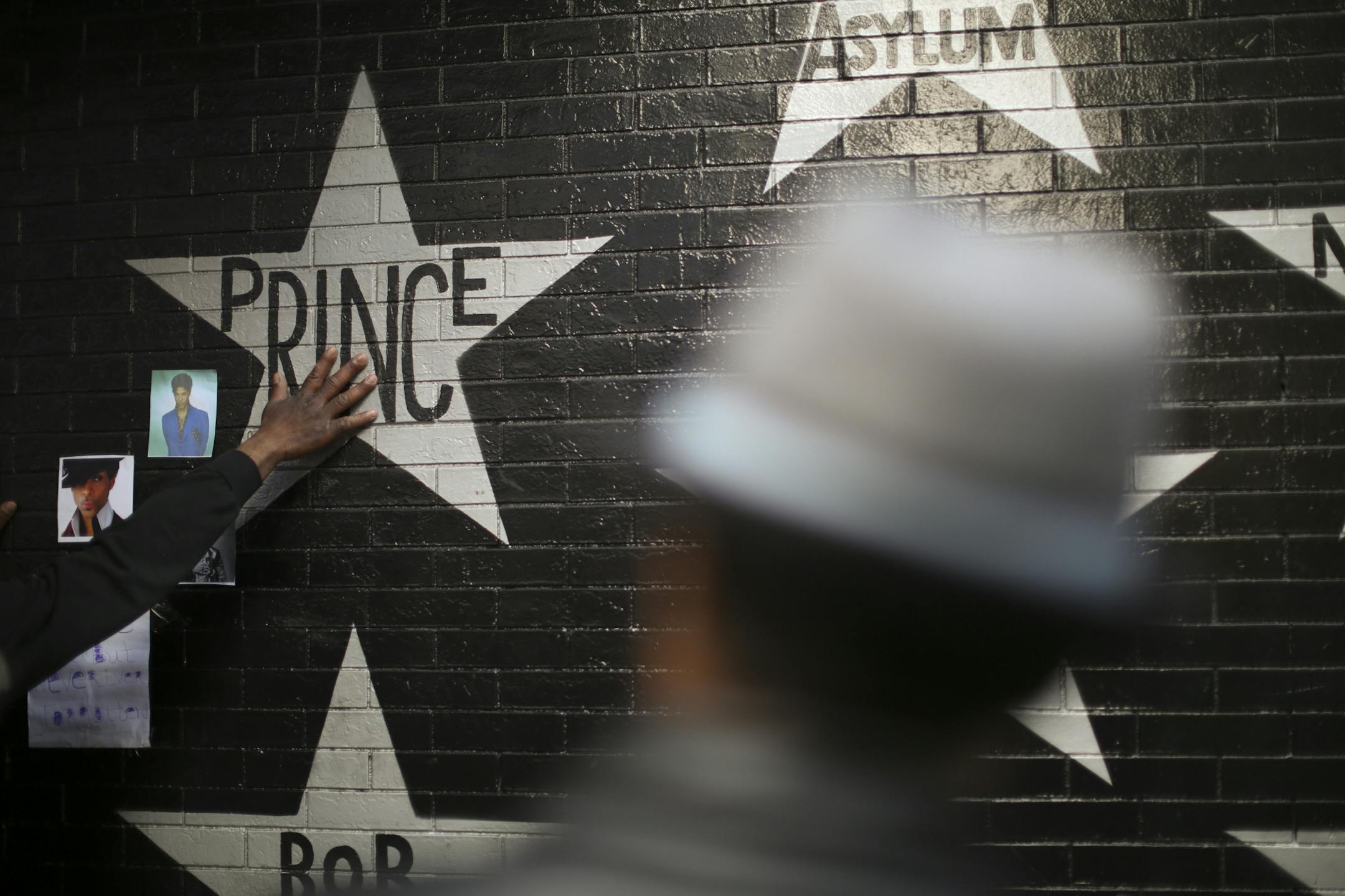 The growing memorial under Prince's star at First Ave. drew multitudes of fans throughout Tuesday afternoon and evening.