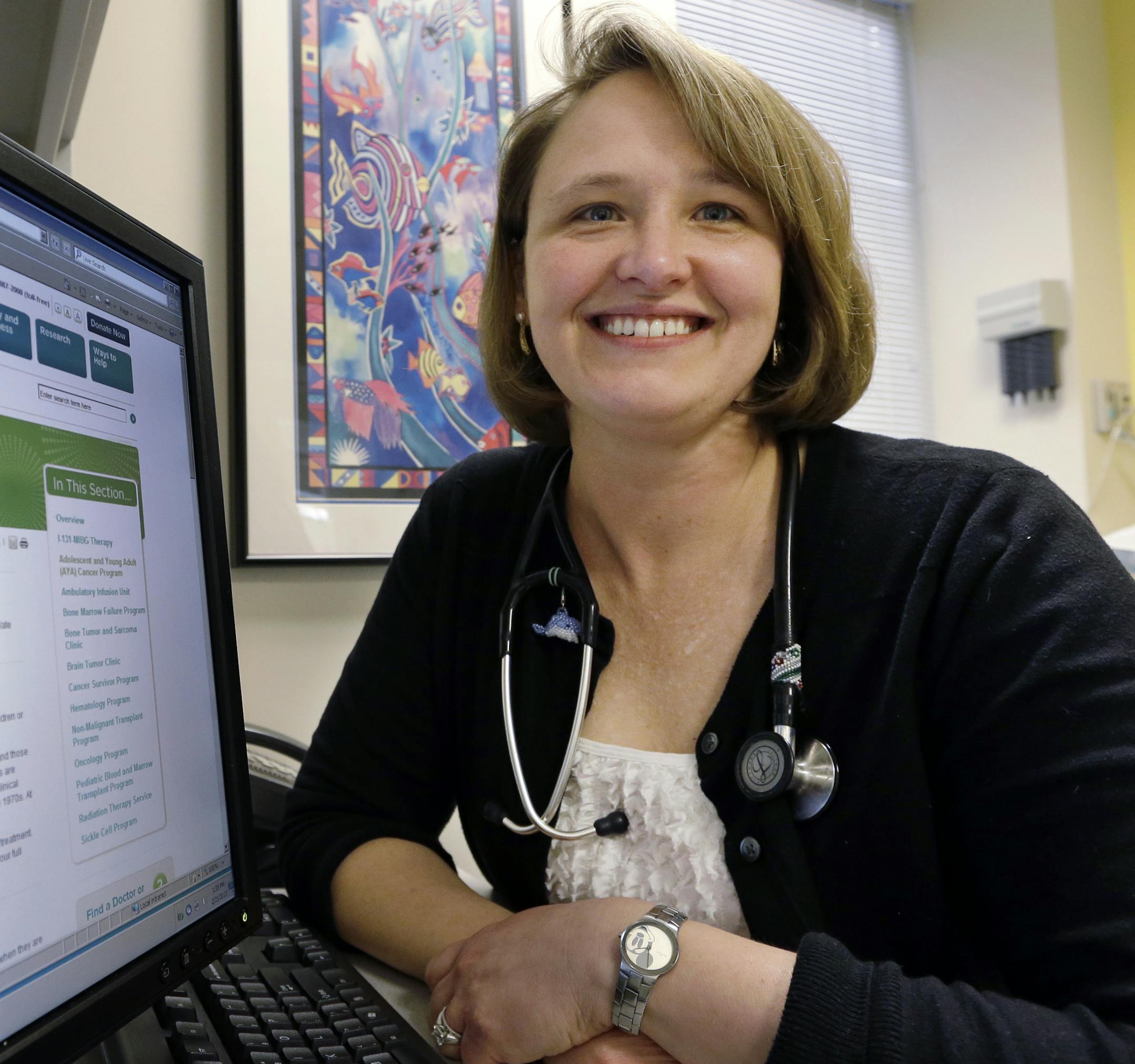 In this Monday, Feb. 25, 2013 photo, Dr. Rebecca Johnson, a cancer specialist at Seattle Children's Hospital, poses in an exam room at the hospital in Seattle. Johnson is the lead author of a new study that shows that advanced breast cancer cases have increased slightly among young women, a 34-year analysis suggests, raising many questions about possible reasons even as the disease remains uncommon in women younger than 40. Johnson herself was diagnosed with early-stage breast cancer at age 27,