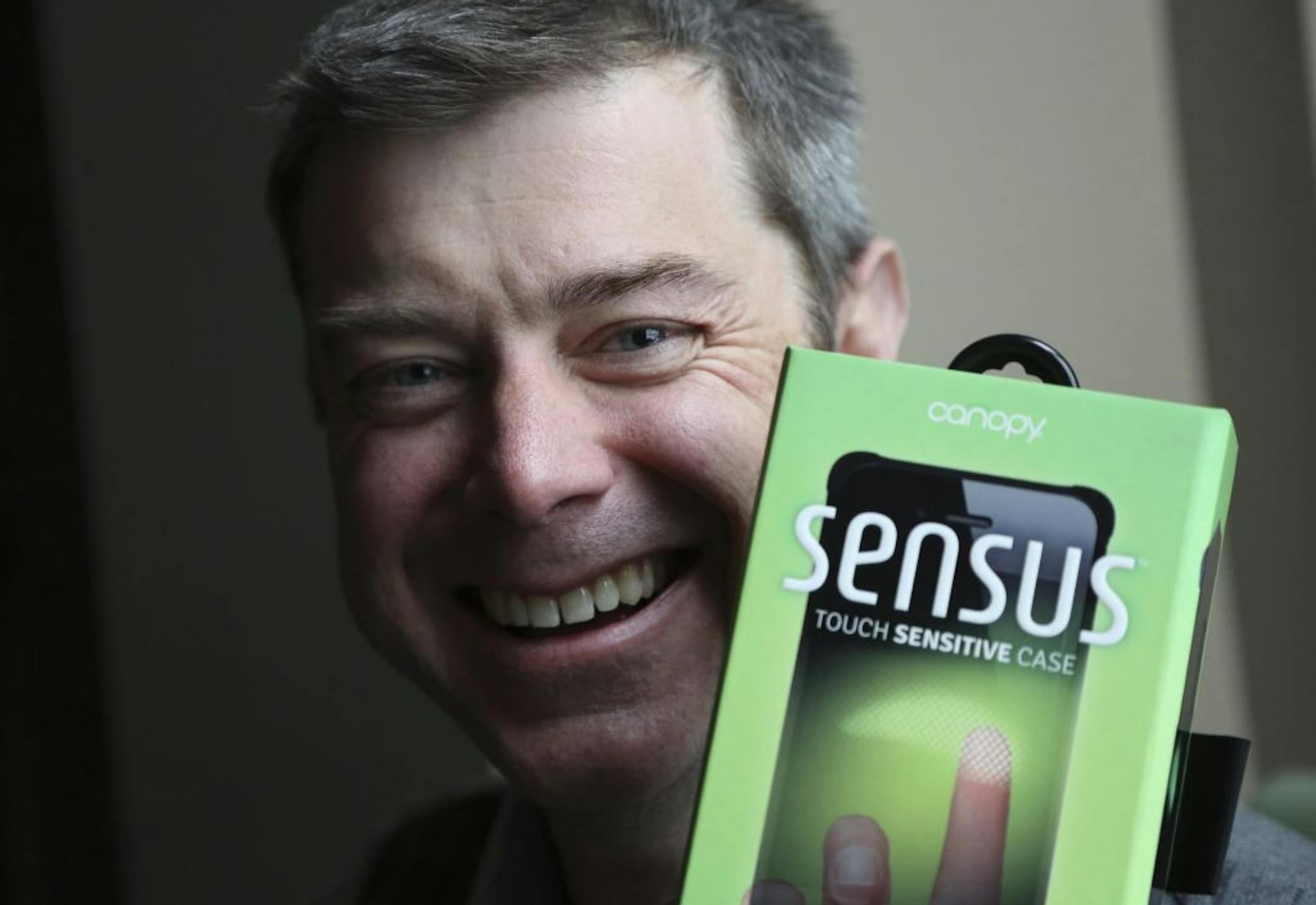 Andrew Kamin-Lyndgaard, CEO of Canopy, held up his touch sensitive case, Sensus, made for the iPhone at his office in Minneapolis, Min., Wednesday January 2, 2012. The protective case containing its own electronics that can mimic the iPhone's touch-sensitive screen.