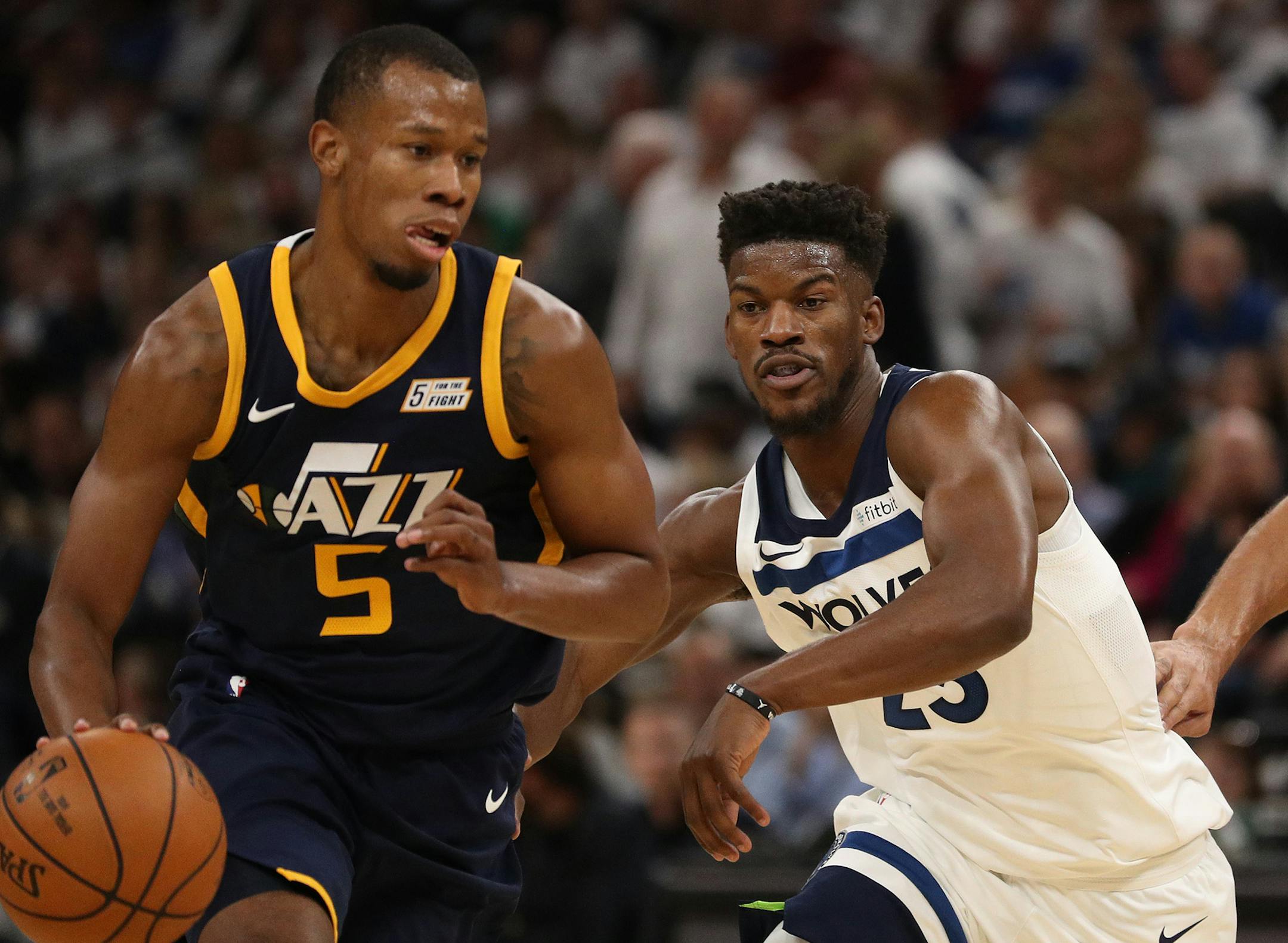 Minnesota Timberwolves forward Jimmy Butler (23) chased after Utah Jazz guard Rodney Hood (5) as Utah Jazz center Rudy Gobert (27) looked on in the first half. ] ANTHONY SOUFFLE ï anthony.souffle@startribune.com Game action from an NBA game between the Minnesota Timberwolves and the Utah Jazz Friday, Oct. 20, 2017 at the Target Center in Minneapolis.