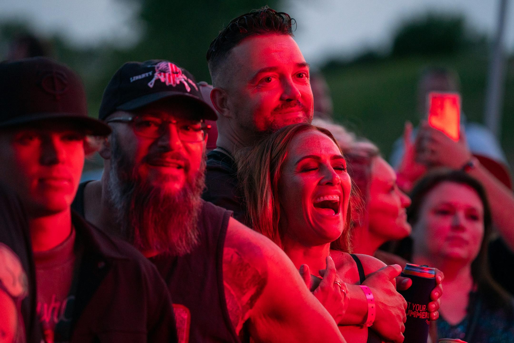 Fans in the front row dance and sing as Jelly Roll, a rising country music star, performs Friday, July 07, 2023, at Mystic Lake Casino amphitheater in Prior Lake, Minn.