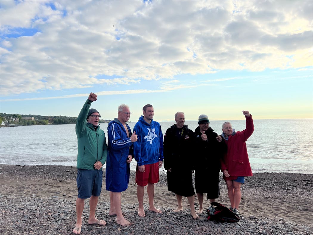 The marathon relay swimmers posed post-swim in Canal Park Wednesday morning. They are, left to right, Casey McGrath, 51, of Minneapolis; Craig Collins, 64, of Minneapolis; Seth Baetzold, 28, of Maplewood; Michael Miller, 57, of Minneapolis; Jeff Everett, 62, of Oakland, Calif., and Karen Zemlin, 55, of Plymouth.