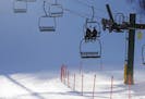 In this photo taken Feb. 10, 2016, skiers ride the chair lift at Giants Ridge in Biwabik, Minn. A new report by the Office of the Legislative Auditor 
