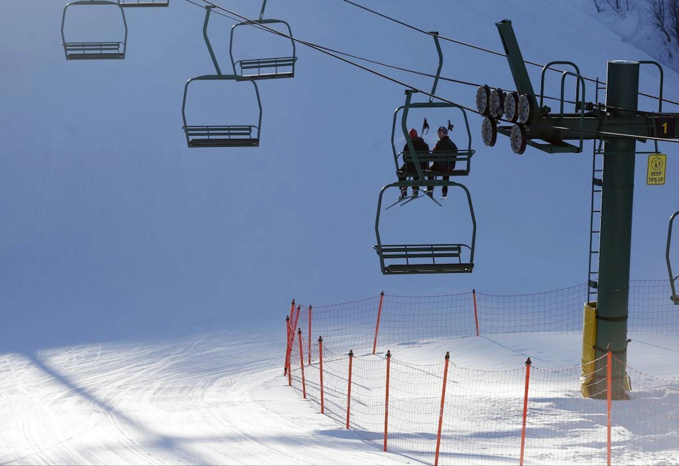 In this photo taken Feb. 10, 2016, skiers ride the chair lift at Giants Ridge in Biwabik, Minn. A new report by the Office of the Legislative Auditor suggests the structure of the Iron Range Resources and Rehabilitation Board (IRRRB) may be unconstitutional. The Office of the Legislative Auditor made that conclusion in an audit released Friday, March 18, that also shows the agency has heavily subsidized Giant's Ridge ski resort amid heavy losses.