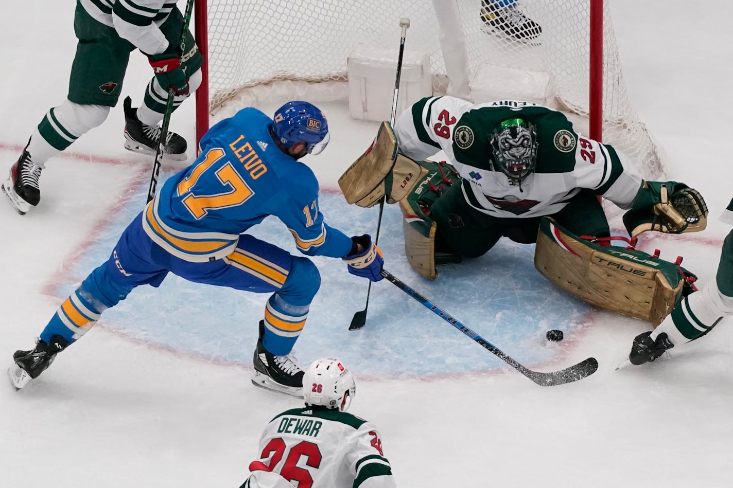 St. Louis Blues' Josh Leivo (17) is unable to score past Minnesota Wild goaltender Marc-Andre Fleury (29) during the third period of an NHL hockey game Saturday, Dec. 31, 2022, in St. Louis. (AP Photo/Jeff Roberson)