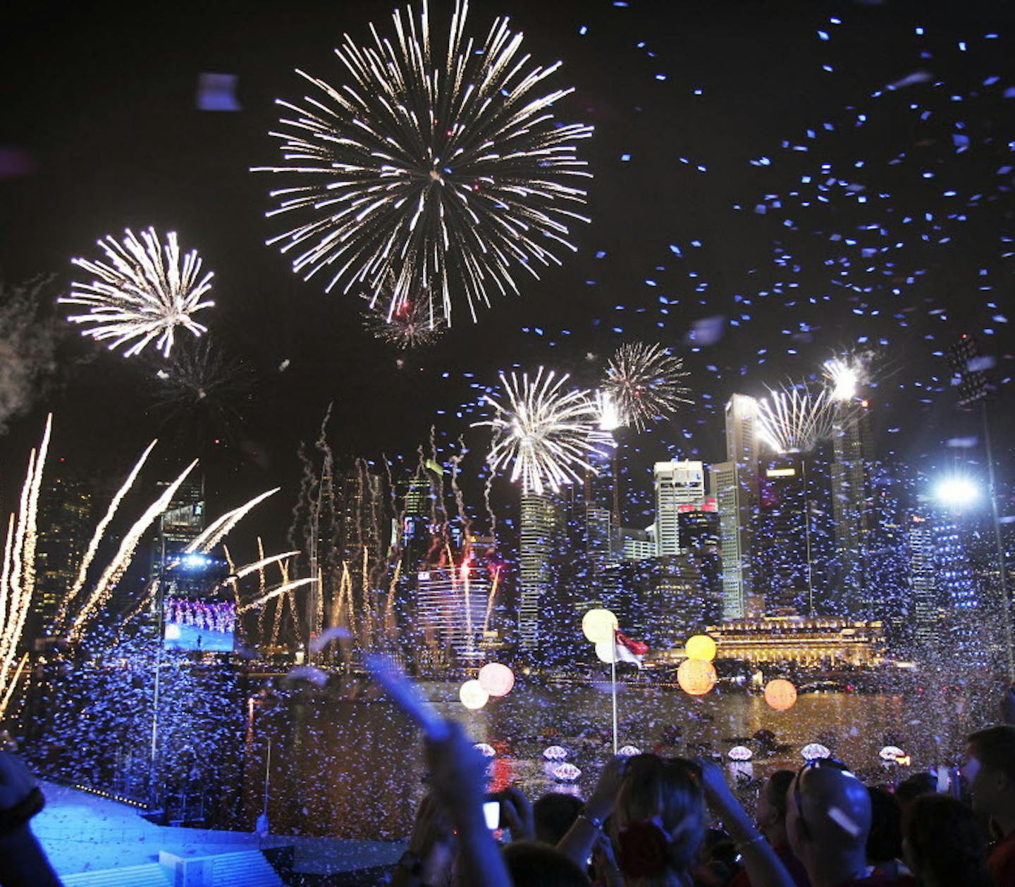 Fireworks explode above the financial skyline on Tuesday Aug. 9, 2011 in Singapore which celebrates its 46th year of independence. Singapore declared independence on Aug. 9, 1965. (AP Photo/Wong Maye-E)