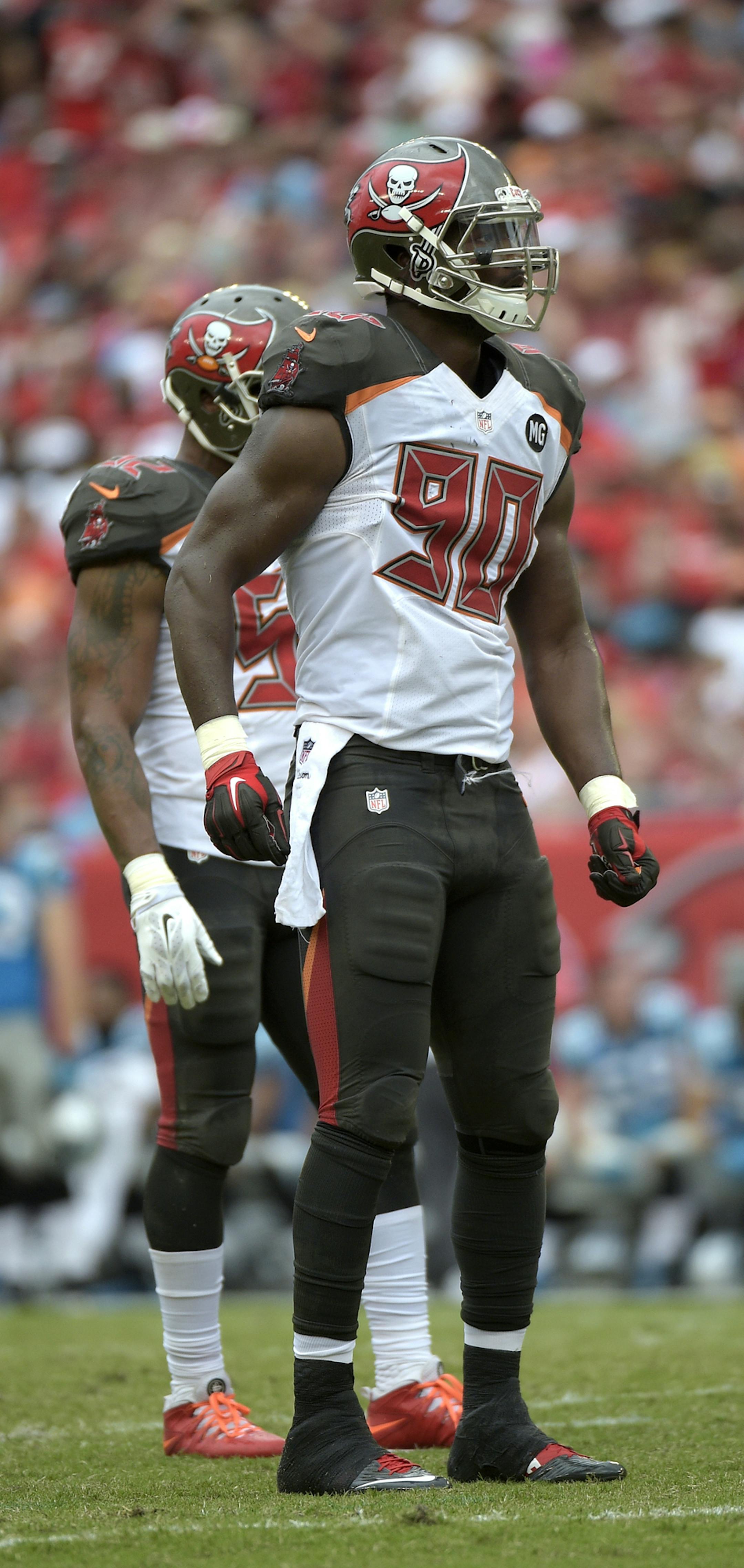 Tampa Bay Buccaneers defensive end Michael Johnson (90) waits for a play at the line of scrimmage during the second half of an NFL football game against the Carolina Panthers in Tampa, Fla., Sunday, Sept. 7, 2014.(AP Photo/Phelan M. Ebenhack) ORG XMIT: OTKPANT310
