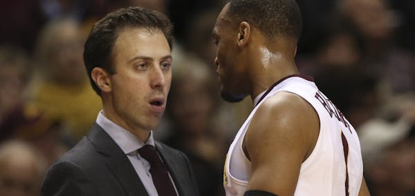 Gophers head coach Richard Pitino spoke with Gophers guard Andre Hollins as he came off the court in the second half Wednesday night at Williams Arena