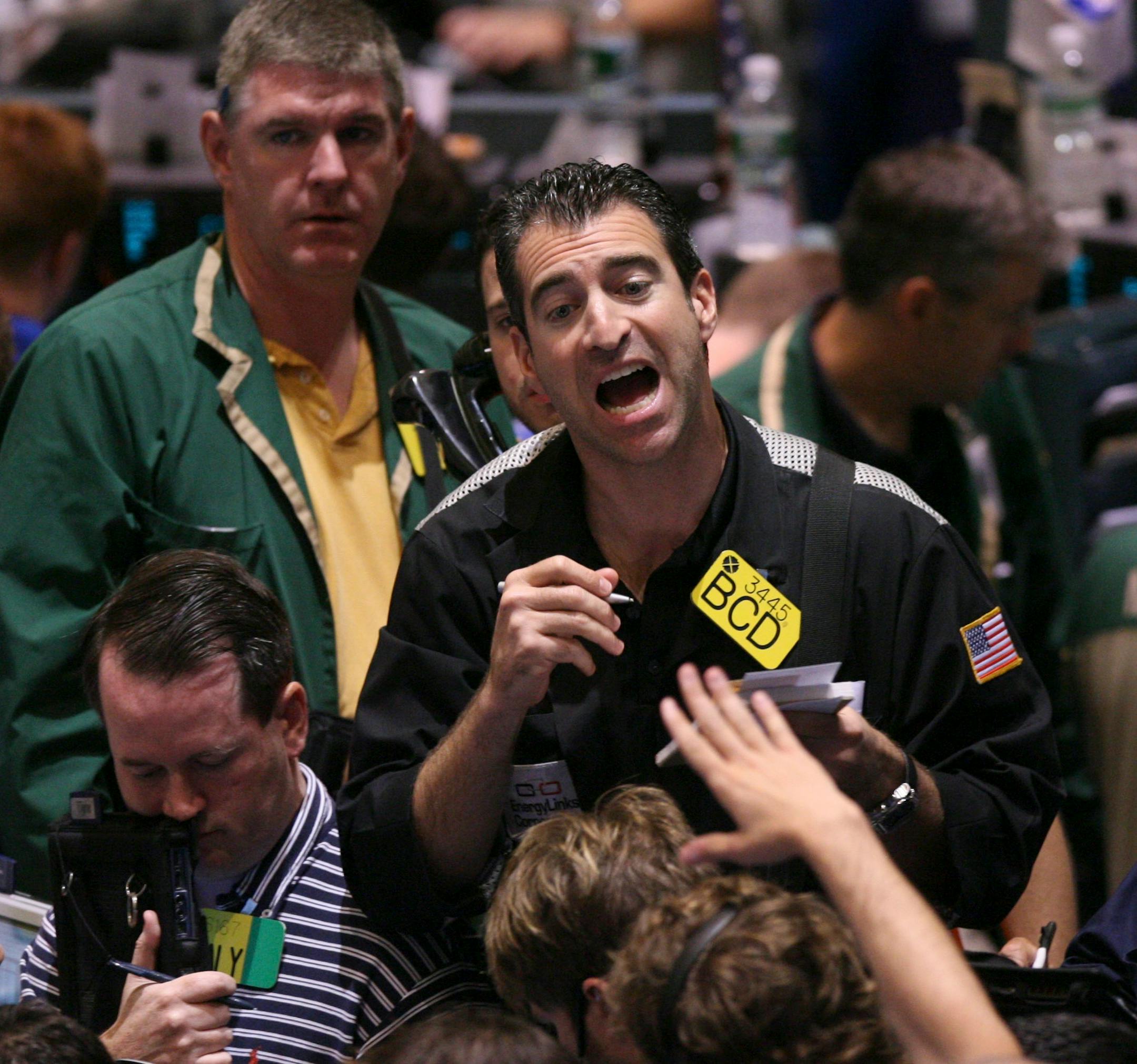 Traders work the crude oil options pit at the New York Mercantile Exchange Friday, July 11, 2008 in New York. Oil prices spiked to a new record above $147 a barrel Friday, as rising hostilities between the West and Iran and the potential for attacks on Nigerian oil facilities gave investors reason to rush back into the energy markets.