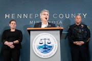 Hennepin County Attorney Mary Moriarty speaks while being flanked by attorney Siara Melius and Brooklyn Park Police Chief Mark Bruley, left to right, 
