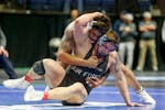  Penn State’s Greg Kerkvliet, on top in above photo, beat Air Force’s Wyatt Hendrickson in the heavyweight semifinals at the NCAA Division I wrest