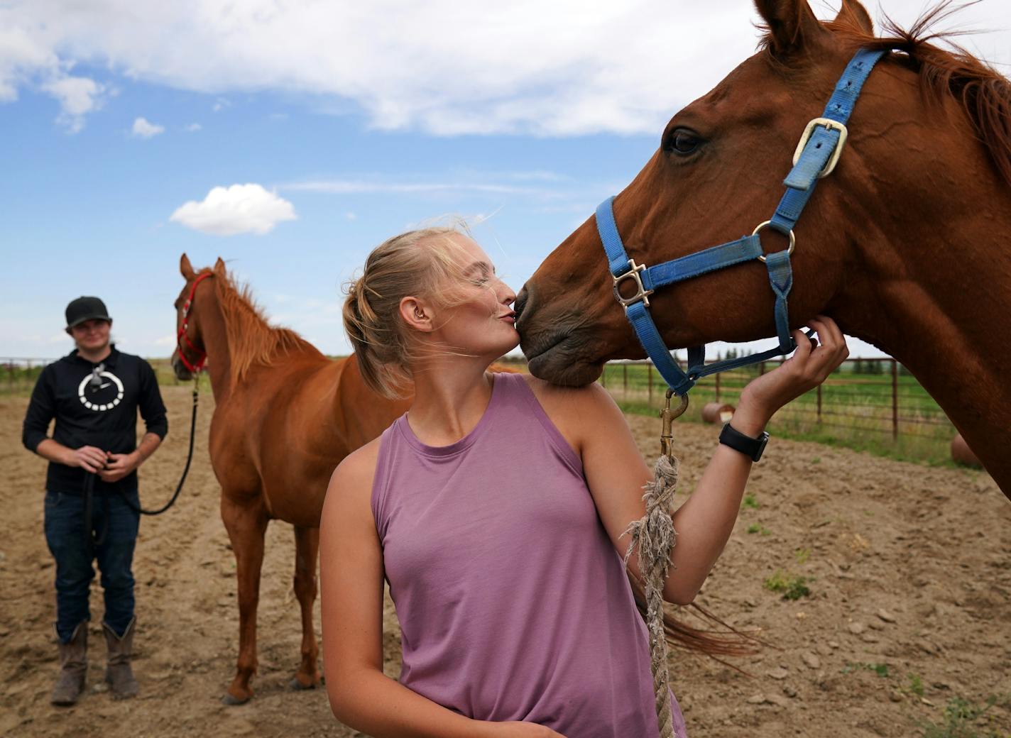 Anne Johnson showed some love to a horse she recommended to Dalton Larson. When horses arrive at the ranch, Johnson studies them to determine what kind of career and owner will be the best fit. "These are incredible animals,'' she says. "They just need the right person.''