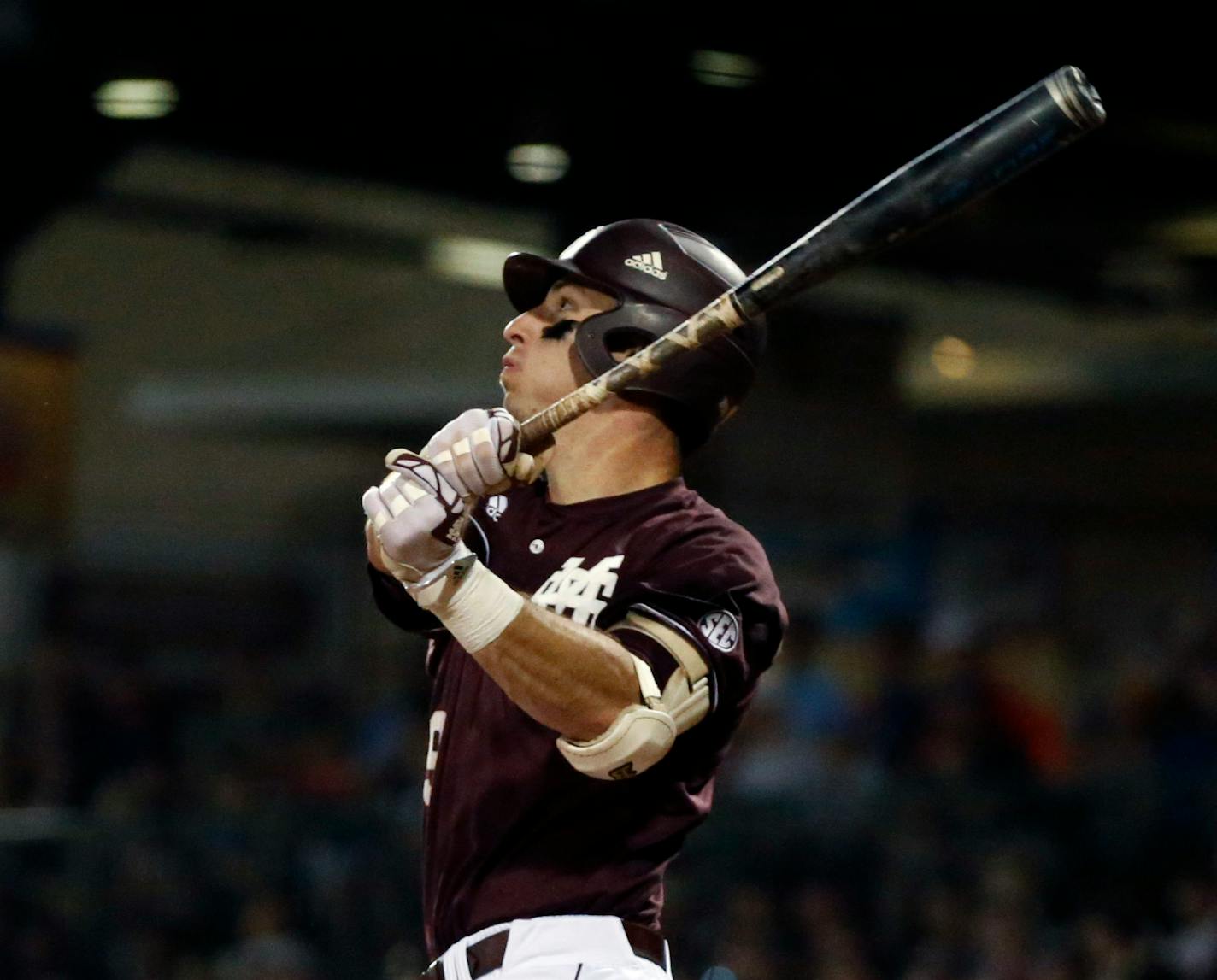 Mississippi State's Brent Rooker watches his three run home run against Mississippi fly into the stands in the fifth inning of the Governor's Cup in an NCAA college baseball game at Trustmark Park Stadium in Pearl, Miss., Tuesday, April 25, 2017. (AP Photo/Rogelio V. Solis)