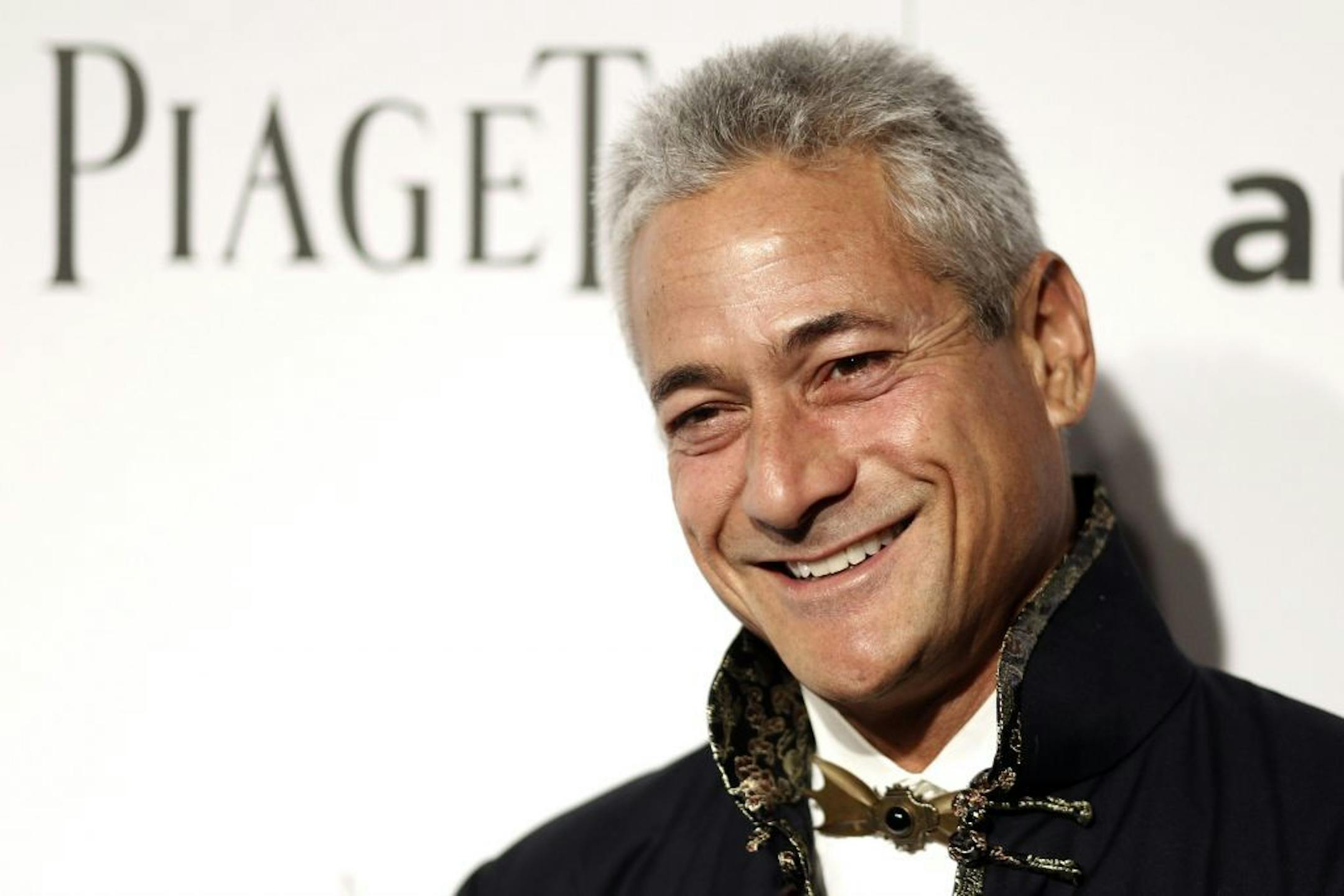 FILE - In this Oct. 27, 2011 file photo, former Olympic diving champion Greg Louganis arrives at amfAR's Inspiration Gala in Los Angeles. Louganis plans to get married this fall. People magazine says the 53-year-old Louganis will marry paralegal Johnny Chaillot.