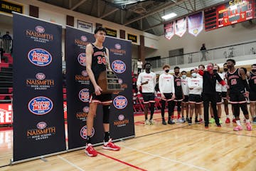 Minnehaha Academy's Chet Holmgren (34) accepted the Naismith Prep Player of the Year Award before a game at Minnehaha Academy in Minneapolis, Minn., o