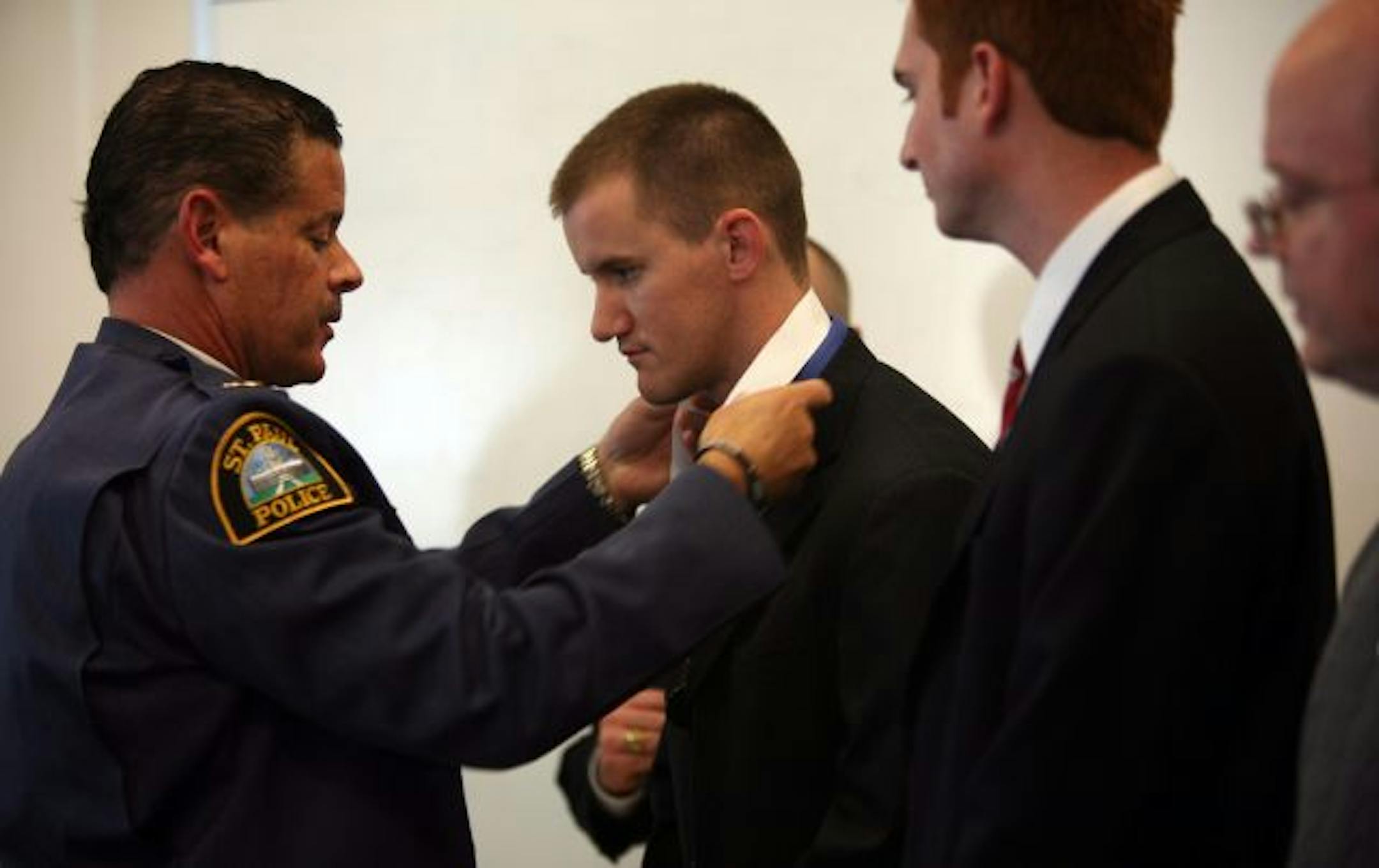 St Paul Police Chief Thomas Smith presented Bryan Hamilton with the Chief's Citizen Award on Thursday. Hamilton and five others pulled a suicidal man from an unstable cliff. "This is neighbors helping neighbors and that's what makes our community safe," Smith said.