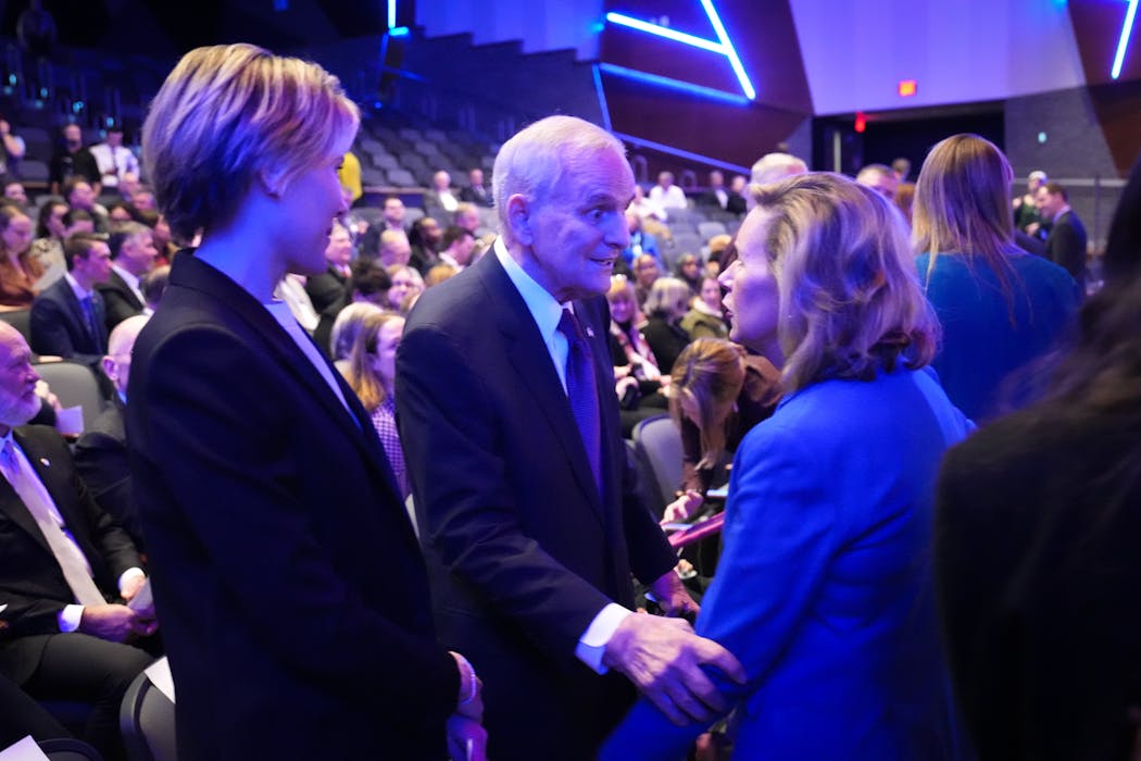 First Lady Gwen Walz visited with former Gov. Mark Dayton and his wife, Ana, at Owatonna High School before Gov. Tim Walz delivered the State of the State address Tuesday.
