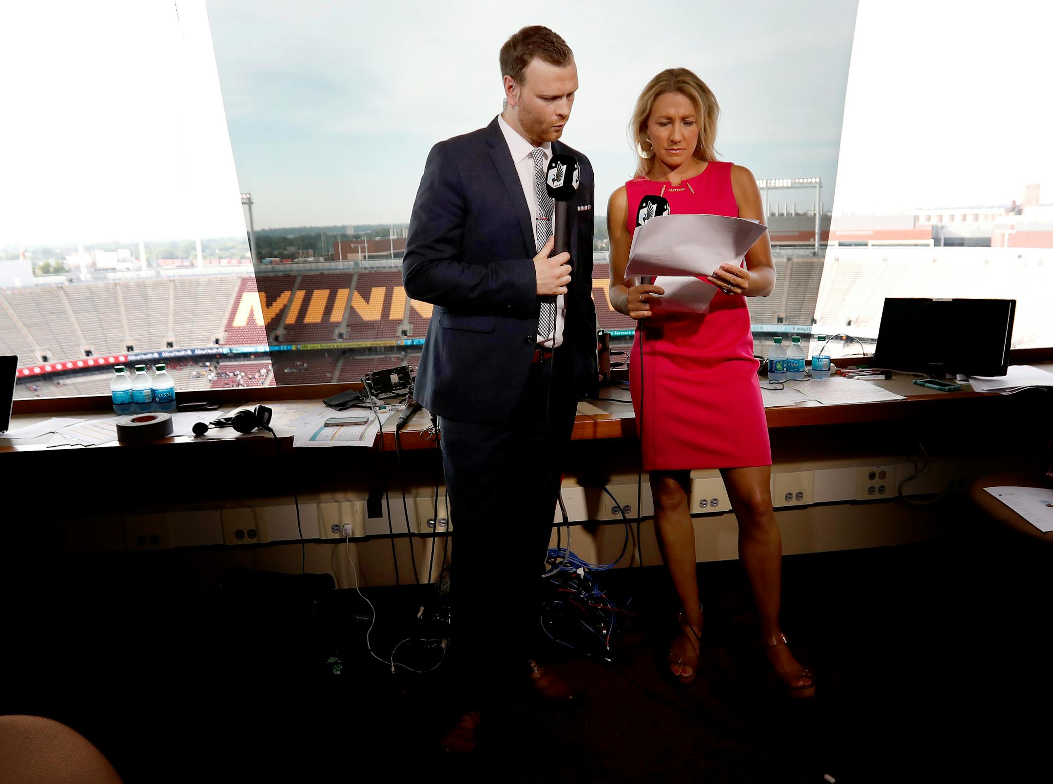 Callum Williams and Kyndra de St. Aubin prepared to go live for a pregame show before a Minnesota United FC game at TCF Bank Stadium last season.