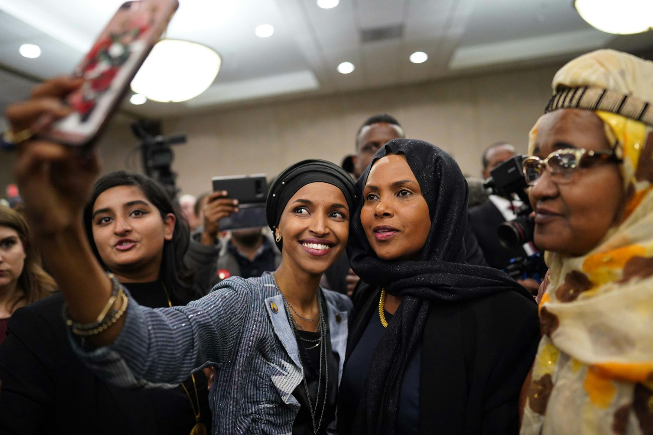 Ilhan Omar poses for a selfies with supporters after her victory. ] MARK VANCLEAVE • mark.vancleave@startribune.com * Ilhan Omar is poised to become the first Somali-American elected to Congress, representing Minnesota's Fifth District. Photographed at her election night headquarters in Minneapolis on Tuesday, Nov. 6, 2018.