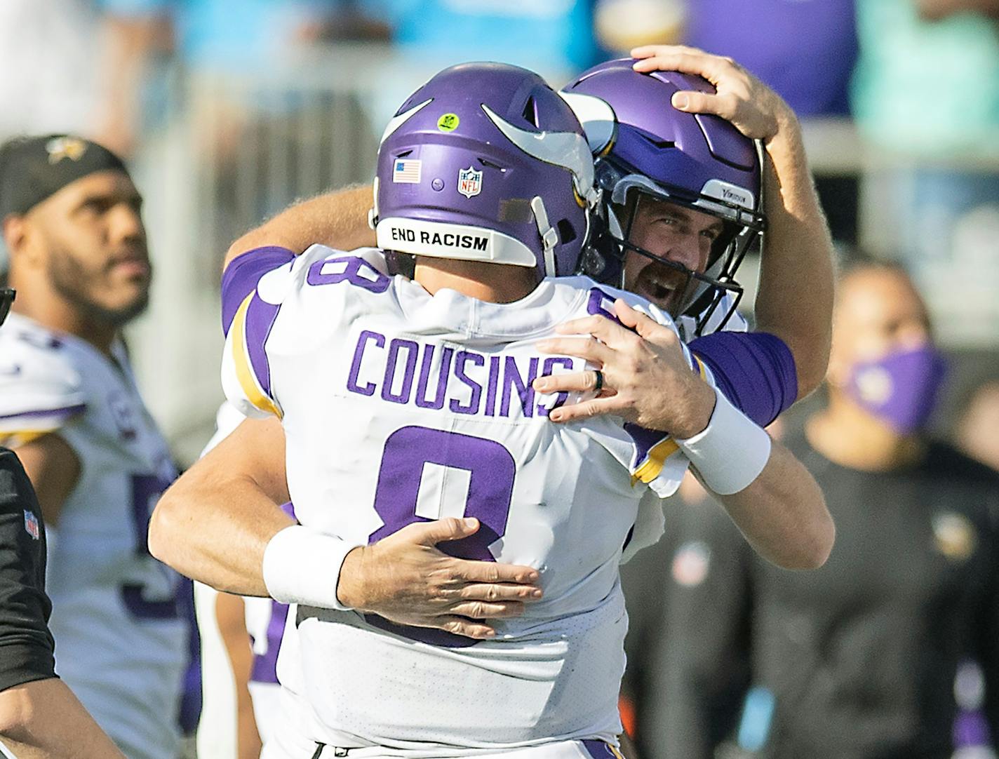 Vikings quarterback Kirk Cousins (8) celebrated with Vikings quarterback Nate Stanley (14) after his pass to Vikings wide receiver K.J. Osborn (17) in overtime to clench a 34 to 28 win, Sunday, October 17, 2021 in Charlotte, NC. ] ELIZABETH FLORES • liz.flores@startribune.com