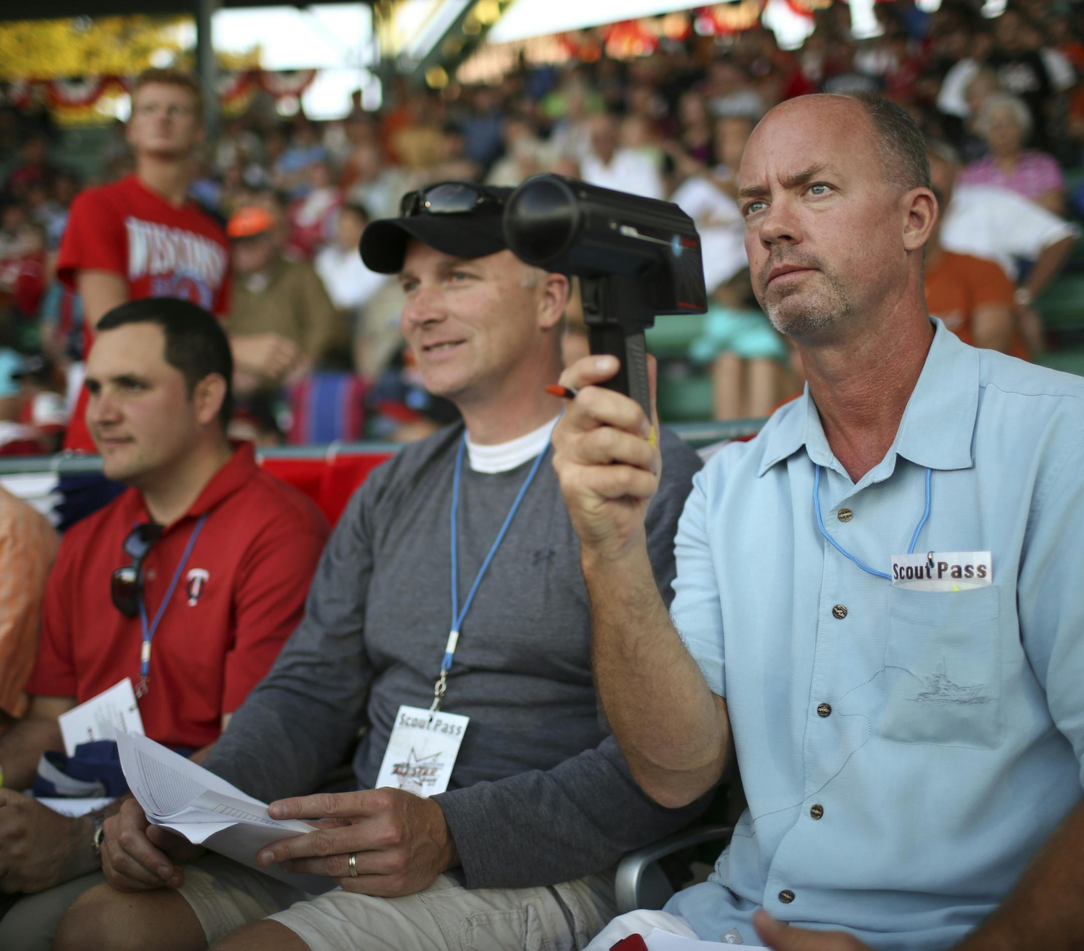 The Northwoods League held their 2013 All-Star Game Tuesday night, July 23, 2013 at Carson Park in Eau Claire, Wisconsin. The stadium was crawling with scouts from Major League Baseball teams, including four from the Twins organization. They are, from right, Mark Wilson, north central area scout, Jeff Kaldor, an associate, Rafael Yanez, administrative assistant, and Mike Ruth midwest regional supervisor. ] JEFF WHEELER ‚Ä¢ jeff.wheeler@startribune.com