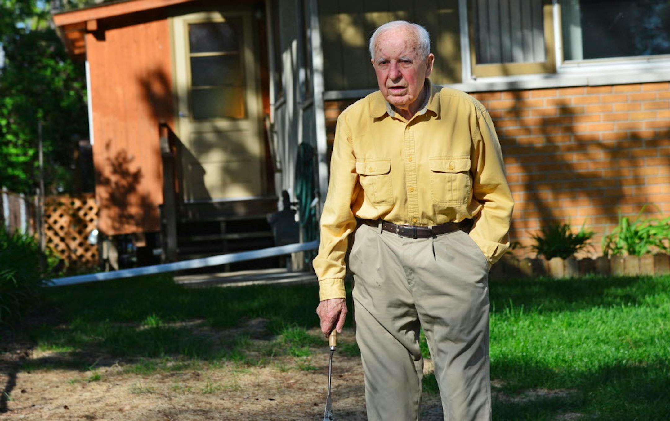 Michael Karkoc, pictured in his Minneapolis yard in 2014, is accused of being a commander in an SS-led unit that burned Polish villages and killed civilians in World War II.