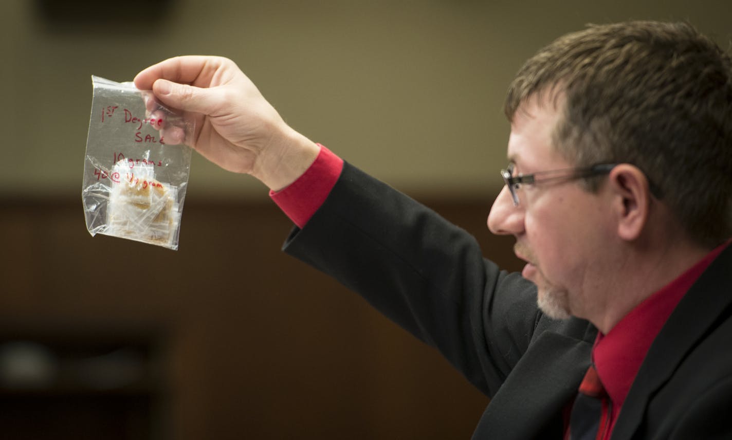 Charles T. Strack, with the MN State Association of Narcotics Investigators, spoke out against relaxed sentencing for some drug sales and possession offenses. He held bags filled with brown sugar to show the relative amounts of drugs that could soon see reduced sentencing if sold or possessed. ] (AARON LAVINSKY/STAR TRIBUNE) aaron.lavinsky@startribune.com The Minnesota Sentencing Guidelines Commission is advancing a proposal to reform drug sentencing rules. It held a public hearing at the State