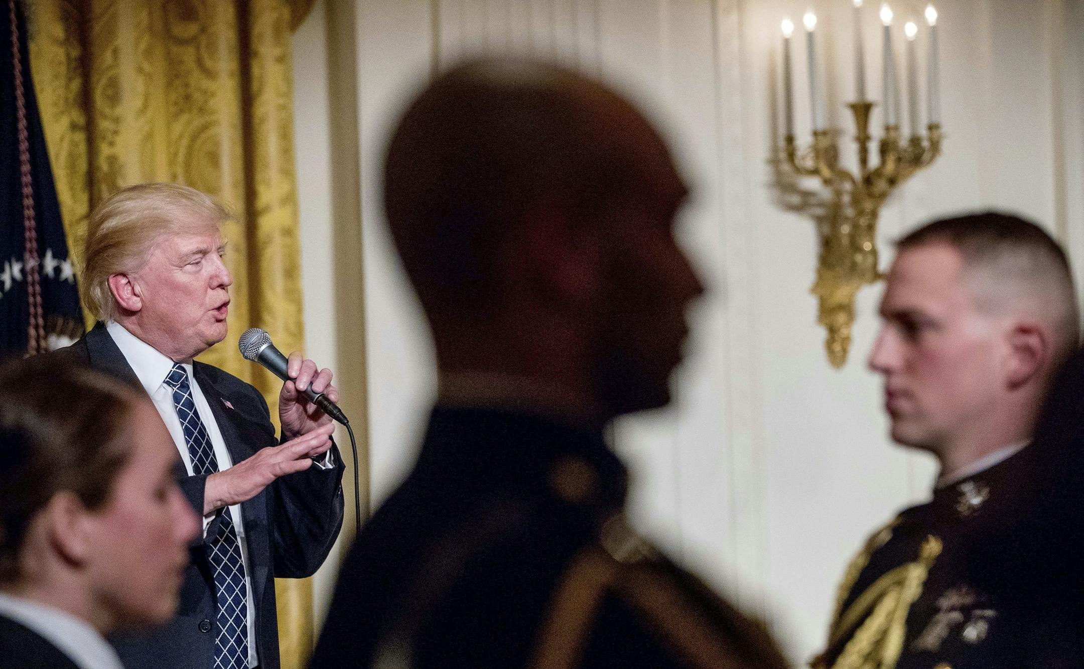 President Donald Trump speaks at a reception for Senators and their spouses in the East Room of the White House, Tuesday, March 28, 2017, in Washington. (AP Photo/Andrew Harnik)