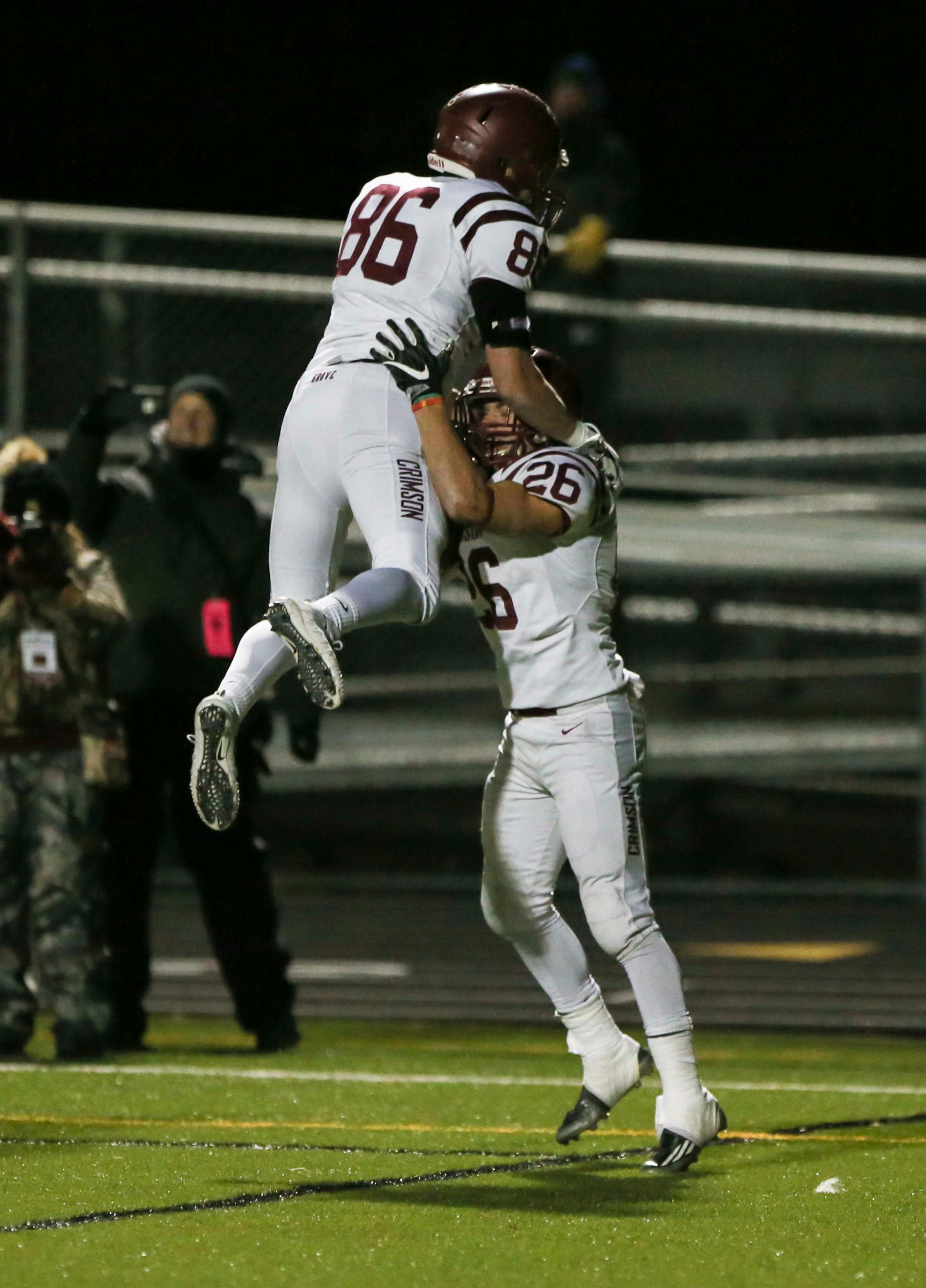 Maple Grove player Ben Schroeder (86) celebrated with Evan Hull (26) after Hull scored the winning touchdown in an incredible comeback win against St. Michael-Albertville. ] RENEE JONES SCHNEIDER • renee.jones@startribune.com Class 6A quarterfinals between St. Michael-Albertville and Maple Grove on Thursday, November 9, 2017, in Brooklyn Park, Minn.
