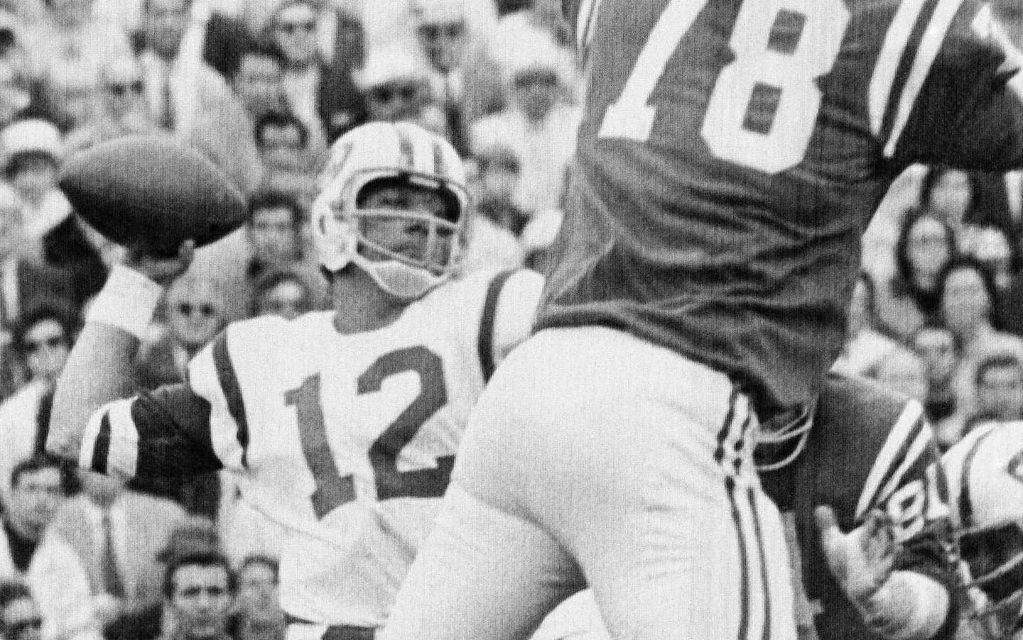 ** ADVANCE FOR WEEKEND EDITIONS, AUG. 29-30 -- FILE -- ** This Jan. 12, 1969, file photo shows New York Jets quarterback Joe Namath throwing the ball as Baltimore Colts' Bubba Smith attempts to block the pass in Super Bowl III, in Miami. (AP Photo/File)