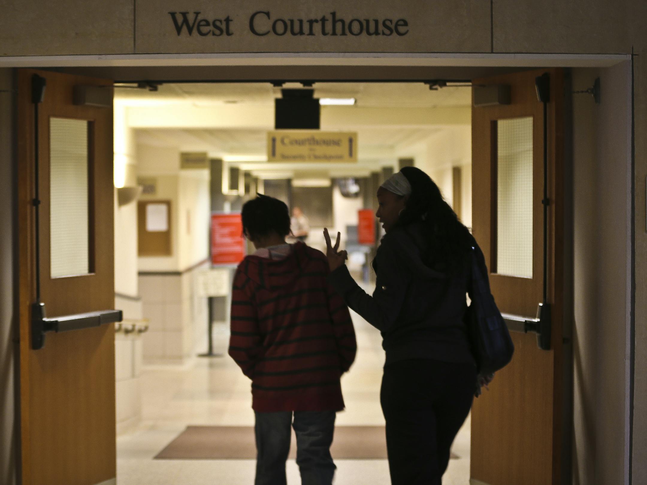 Shameka Griffin walked with her son Gianni Griffin-Davis into the Anoka County Courthouse for a hearing on Gianni's competence in a sexual misconduct case on Thursday, June 6, 2013 in Anoka, Minn. ] (RENEE JONES SCHNEIDER * reneejones@startribune.com)