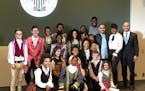 Students from the Lundstrum Center pose for a post-performance photo with three "Hamilton" actors and the president of the Federal Reserve Bank of Min