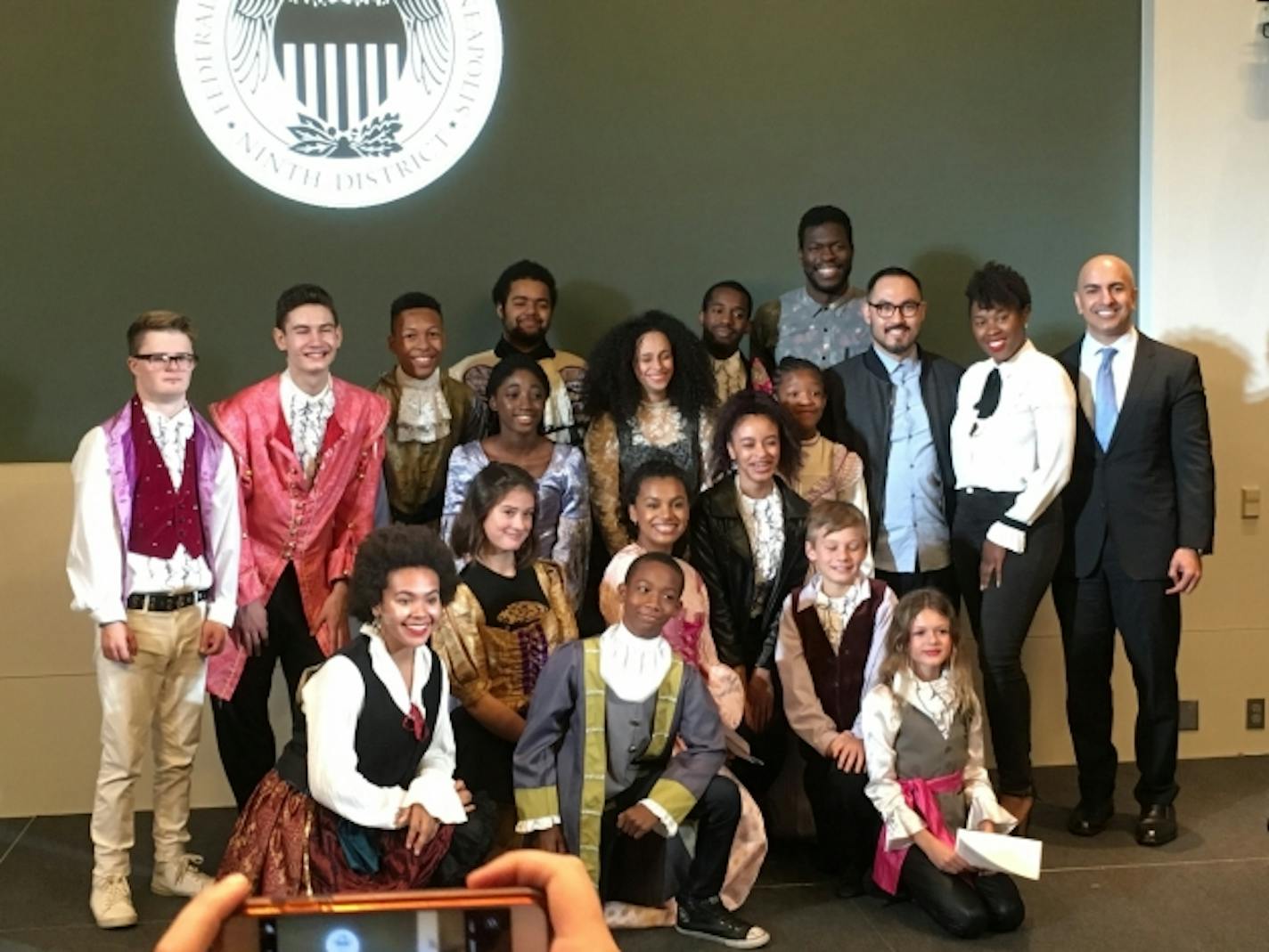 Students from the Lundstrum Center pose for a post-performance photo with three "Hamilton" actors and the president of the Federal Reserve Bank of Minneapolis.