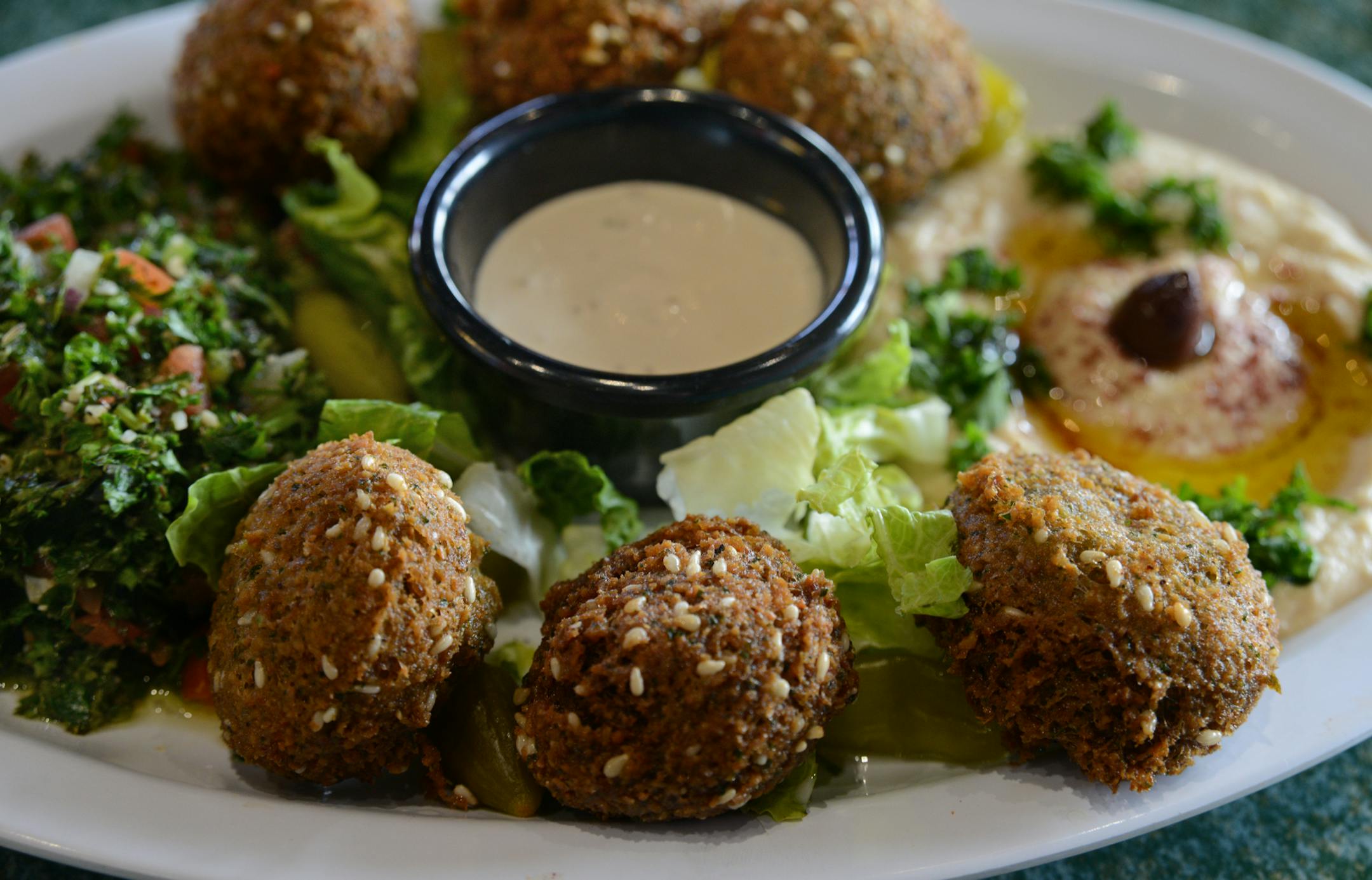 The Filfillah Restaurant features Middle Eastern food and this falafel plateof 6 falafel, hummus, salad and tabouli is fairly typical . ] Ethnic restaurants and grocery stores line Central Avenue in Columbia Heights, drawing community members and commuters alike to sample different cultures' cuisines. Richard.Sennott@startribune.com Richard Sennott/Star Tribune Columbia Heights , Minn. Tuesday 3/11/2014) ** (cq)