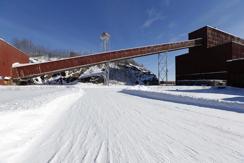 FILE - This Feb. 10, 2016, file photo shows a former iron ore processing plant near Hoyt Lakes, Minn., that would become part of a proposed PolyMet copper-nickel mine. Two public meetings are scheduled for Wednesday, Feb. 7, 2018, in Aurora, Minn., and Thursday, Feb. 8 in Duluth, Minn., on key permits for the proposed mine in northeastern Minnesota. (AP Photo/Jim Mone, File)